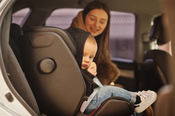 young-mother-child-car-baby-seat-chair-safety-driving-concept